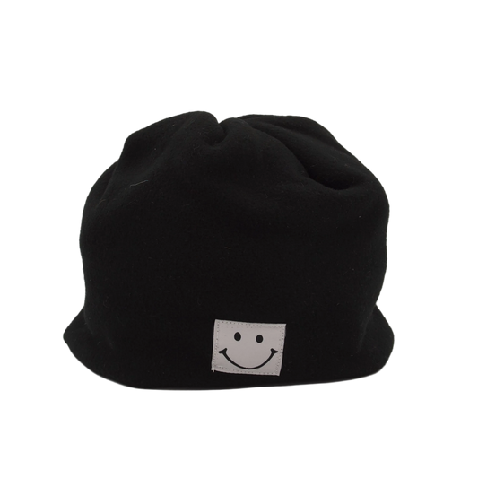 Black beanie with a white smiley face logo on a light gray background